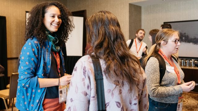 Attendees making a networking connection at SXSW EDU 2019.