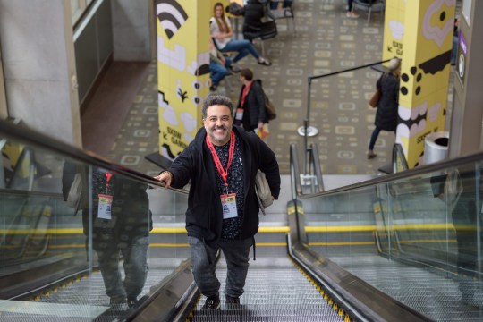 SXSW EDU person on escalator